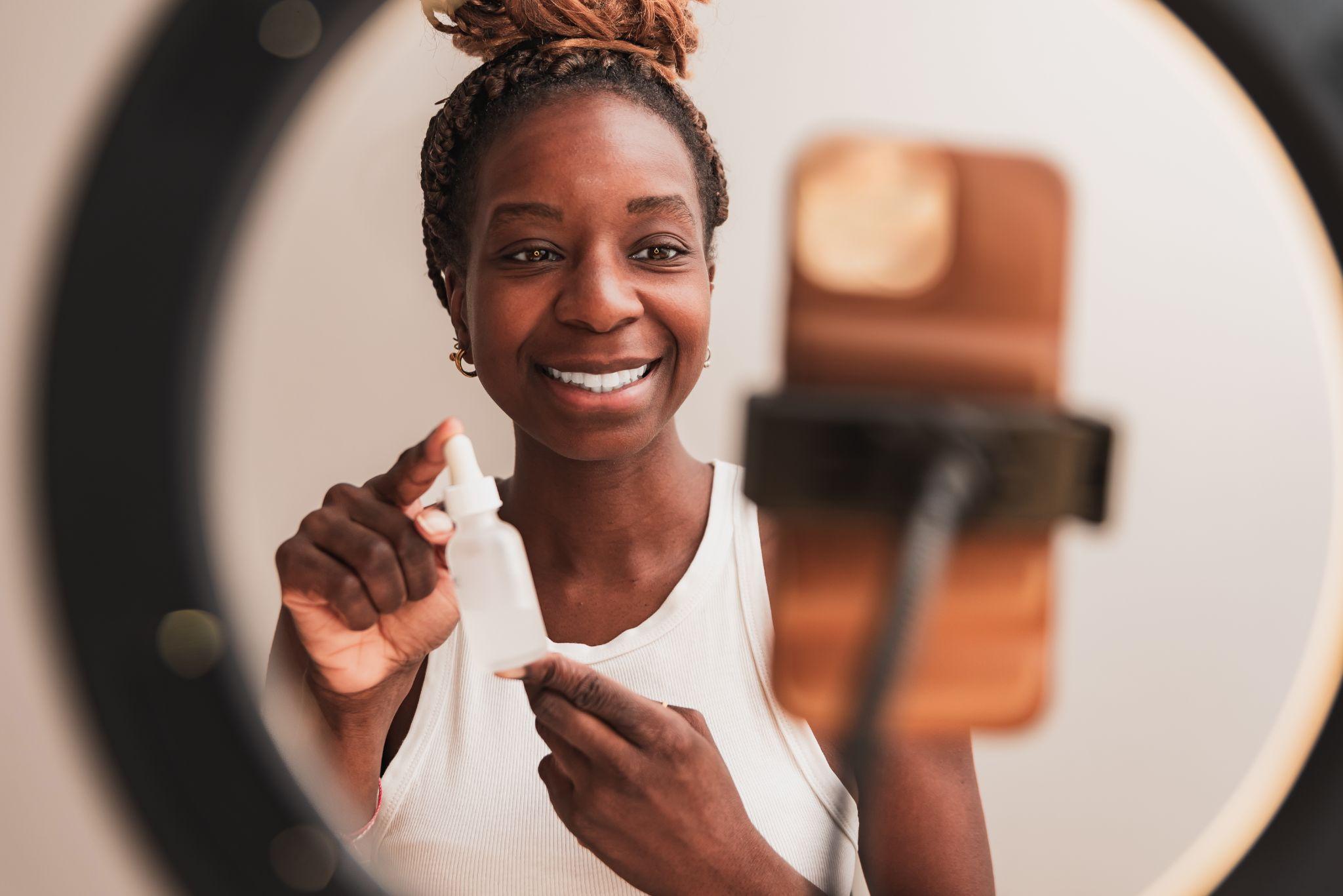 African American influencer woman promoting a product