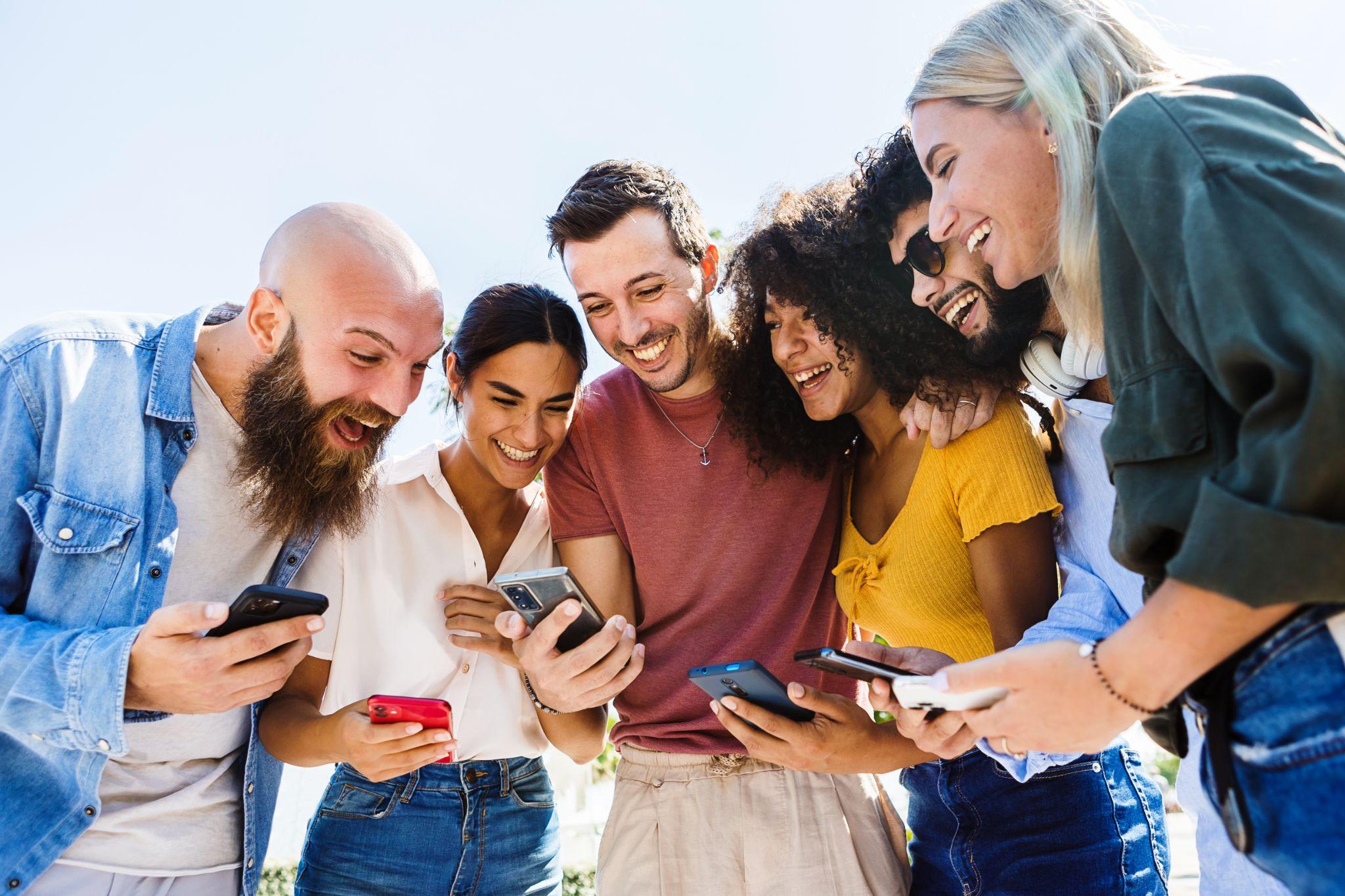 Group of people looking at photos on Instagram