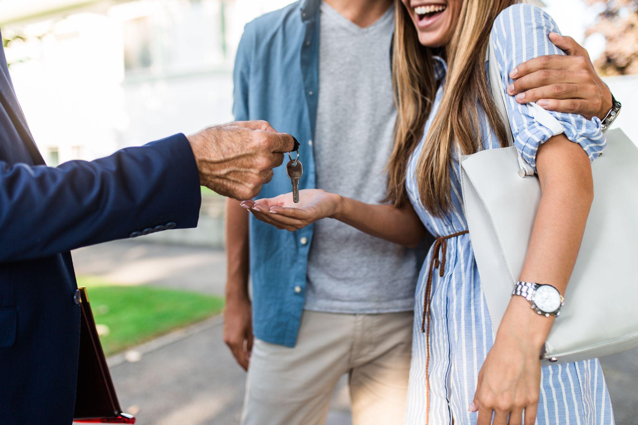 Real estate agent selling a house to a couple