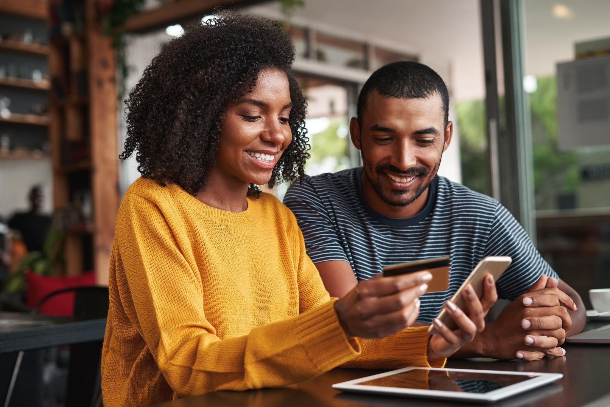 Happy couple shopping online 